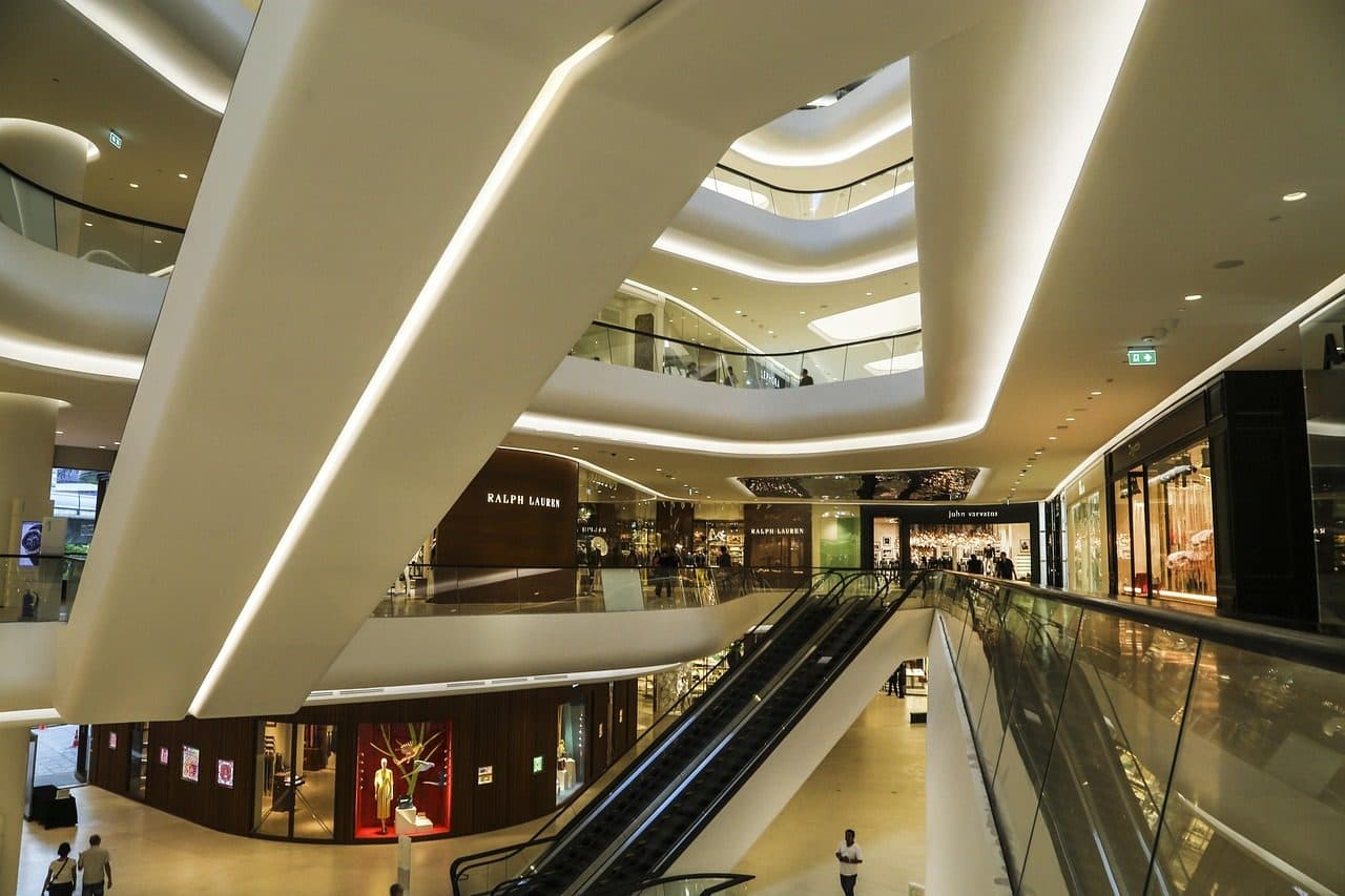 Curving escalators and balconies inside a Bangkok luxury mall