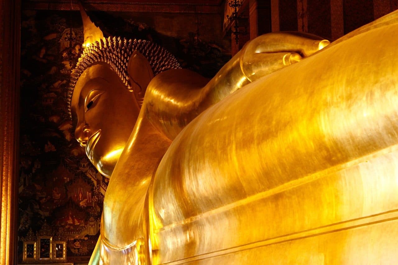 The gilded head and shoulder of the Reclining Buddha at Wat Pho